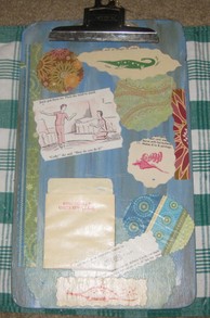 Front of clipboard with decoupaged papers.