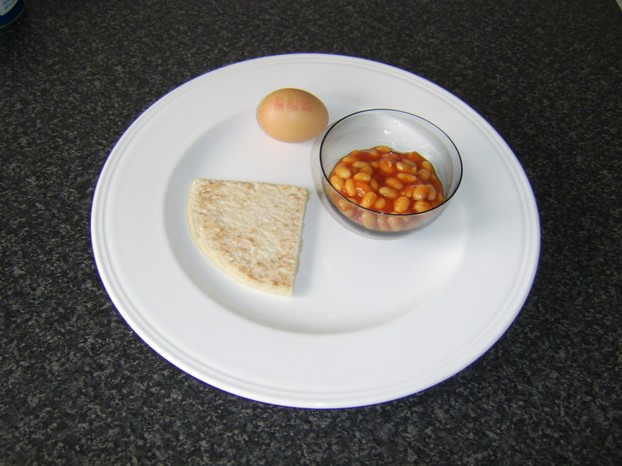 One tattie scone, one egg and two tablespoons of baked beans in tomato sauce