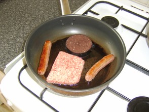 Link sausages, Lorne suasage and black pudding frying