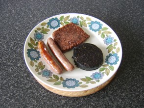 Sausages and black pudding are kept warm