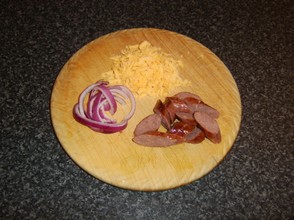 Sliced sausage, red onion and grated cheddar cheese