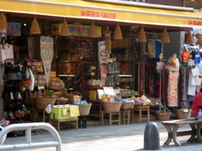 An open front shop.  Even though the Naha Festival is in full flow no-one would think of taking anything from the shop.