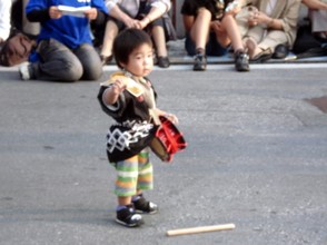 A tiny Eisa Drummer.  Many Okinawan children take up Eisa drumming.