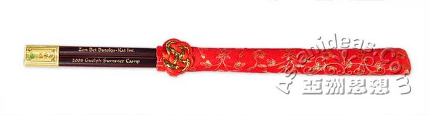 Engraved chopsticks in red silk sleeves