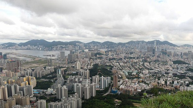 Kowloon and Hong Kong. The old Kai Tak Airport can be seen on the left.