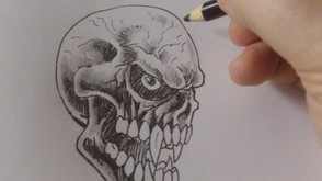 Shade the entire skull with a black crayola pencil.