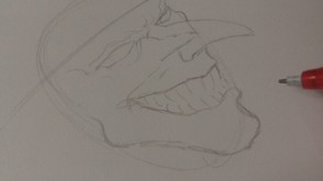 Define the chin and sketch in lines for the teeth.