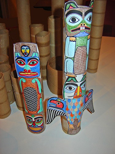 Totems taped onto empty cardboard rolls