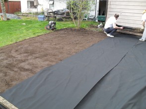 placing landscape fabric