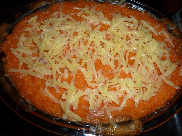 Top the shepherd's pie with grated cheese