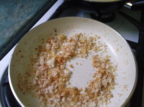 Saute the breadcrumbs in oil, garlic and paprika.