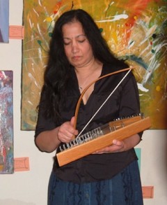 Bina plays a bowed psaltery