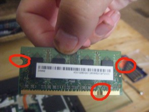 Figure 3 - The memory card for my Acer laptop. I have ringed the side notches to show where the ejector clips fasten and
