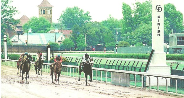 Thoroughbreds approach the finish line in sloppy going at Churchill Downs