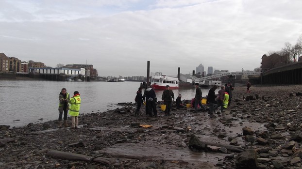 A group exploring the Thames Foreshore