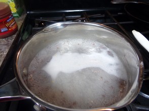 Reduce heat. Stir continuously until thin and foamy