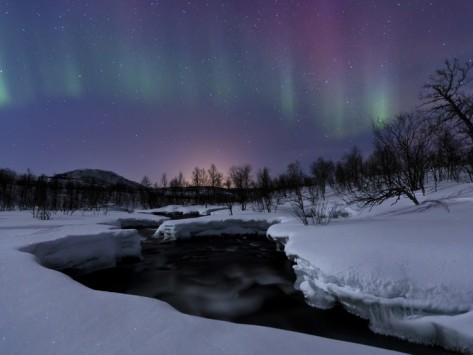 Aurora Borealis over Blafjellelva River in Troms County, Norway