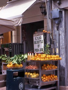 Street stall with fruit and freshly squeezed drinks