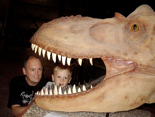 Rick Hyde and his 4-year-old grandson, Channing, check out an Albertosaurus during the 2012 Open House at RCI.