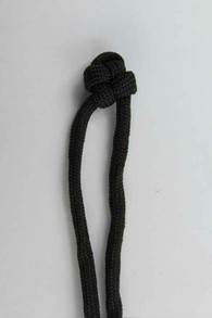 Make a single cross knot on another cord
