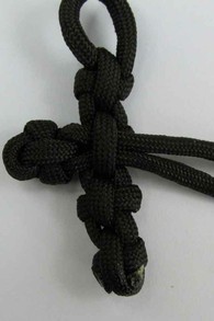 Pull the cord through the back of the four knots