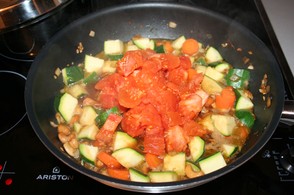 Add diced tomatoes to wok
