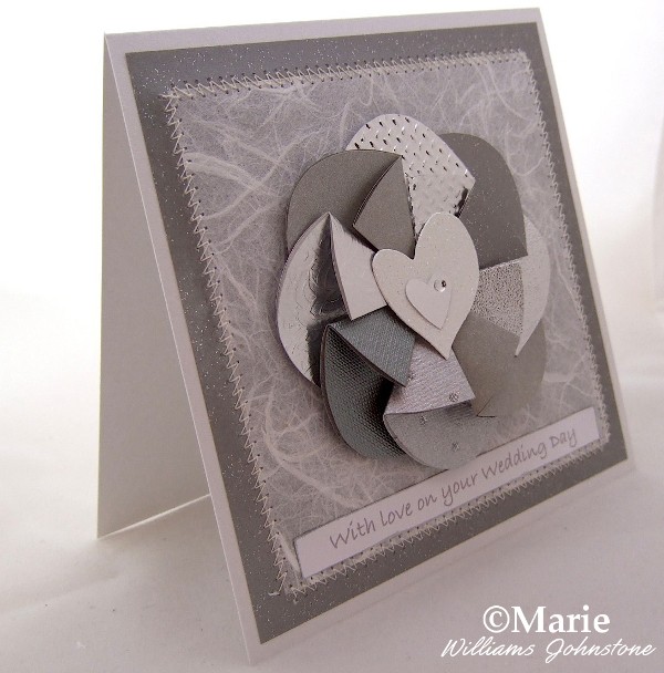 Silver themed wedding card with easy folded flower design