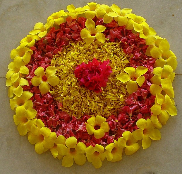 A simple Onam pookkalam made of fresh flowers