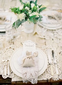 Ornate lace place setting with burlap wedding favor