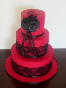 Red wedding cake with black lace
