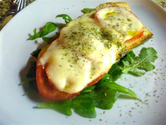 Tuscan-style Crostini with Tomato, Arugula and Mozzarella as served in Florence, Italy.