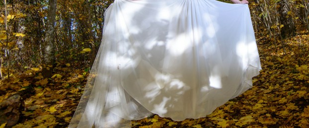 White Bridal Gown on Fall Leaves