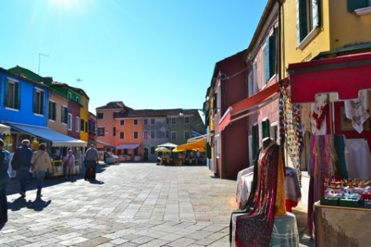 Ride to colorful Burano, where lace makers sell their wares and excellent seafood can be enjoyed