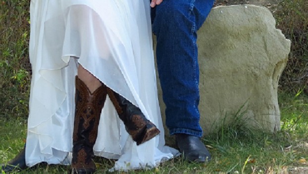 Cowboy and Cowgirl Bride and Groom Show Off Their Boots