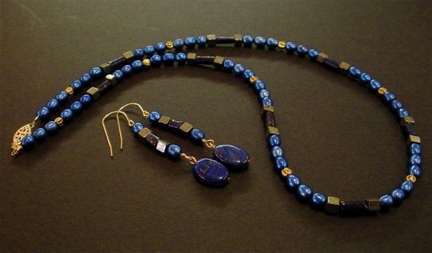 Blue-dyed fresh water pearls, elegant lapis and gold-filled findings make this necklace and earring set.