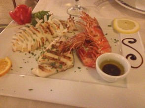 Mixed grilled seafood as served in a restaurant in Naples.