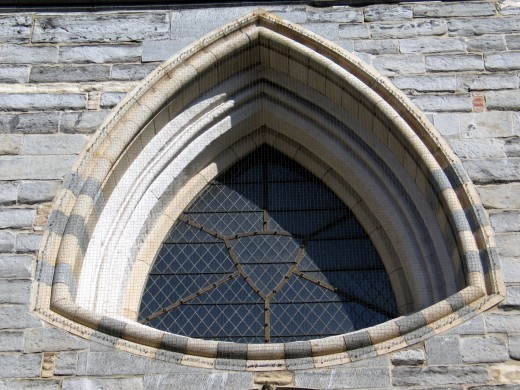 Manhole covers in the shape of the Reuleaux triangle, like the shape of this window, would work because of their constan