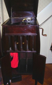 antique phonograph showing oak cabinet with slats