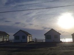 The rows of beautiful, identical shorefront cottages in Truro, Cape Cod. 