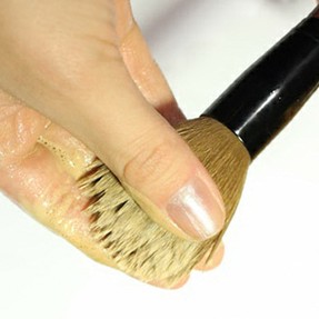 How do you clean makeup brushes?
