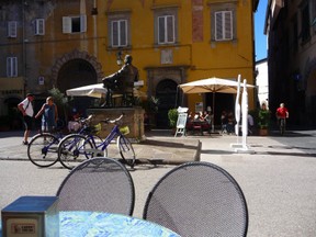 Cafe's in Piazza home of Puccini statue
