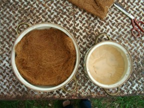 Line bottom of pots with coco or coffee filters