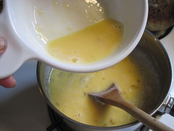 Gradually stir in beaten eggs. 