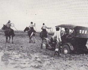 Cowboys towing a car