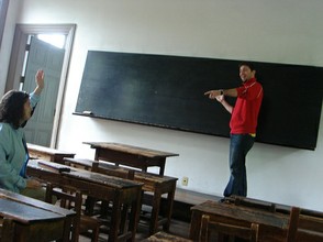 A teacher calling on a student