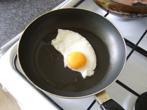 The egg is fried on a medium heat