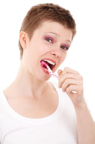 Women Brushing Teeth