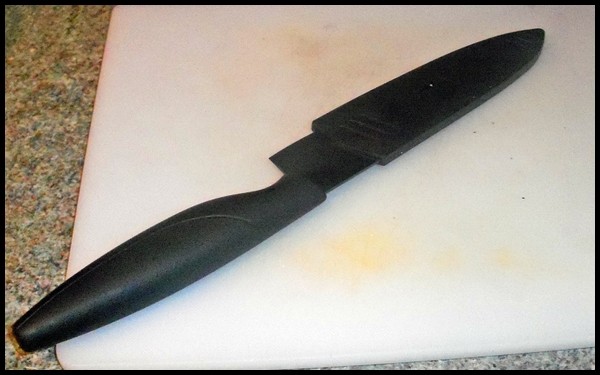 Black ceramic knife in sheath