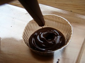 Fill the mold with melted chocolate.