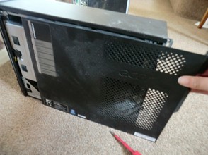 Image: Sliding back a PC case to open it.